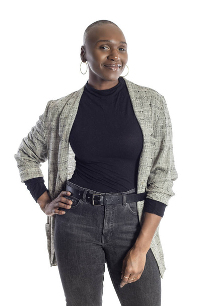 Black African American woman looking confident while wearing modern business casual outfit on a white background.  The businesswoman is depicting bold urban fashion style.  - Valokuva, kuva