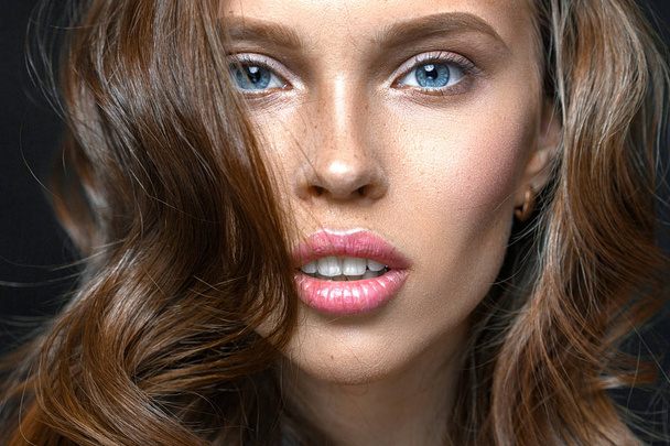 Fashion studio shot of beautiful young woman with make-up. Close-up portrait. - Photo, Image