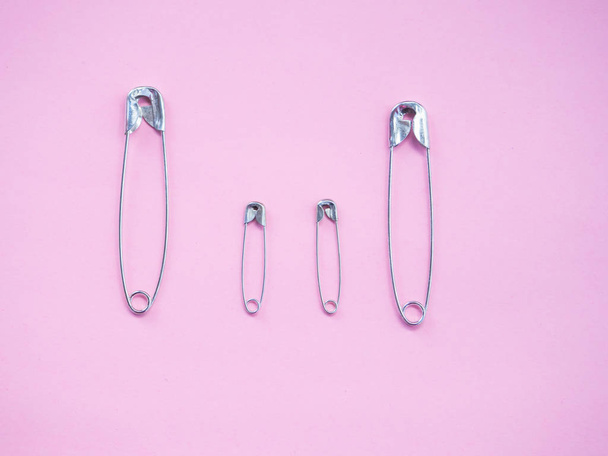 Several safety pins representing an unconventional family of gay, lesbian or transgender - Photo, Image