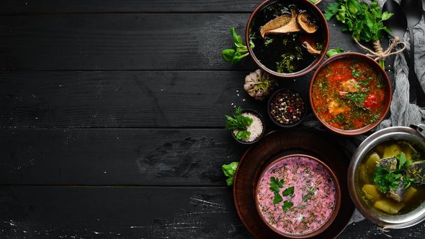 Ukrainian cuisine. Borsch soup with mushrooms, fish soup. Top view. Free space for your text. Rustic style. - 写真・画像