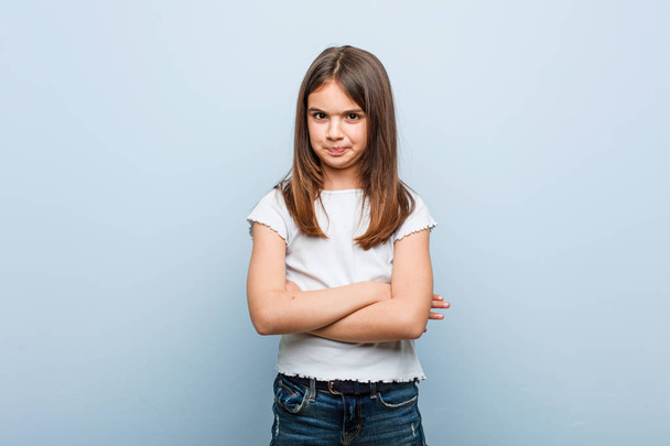 Cute girl frowning face in displeasure, keeps arms folded. - Photo, Image
