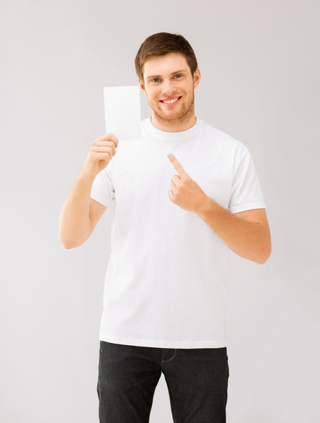 Man pointing at blank white paper - Foto, imagen