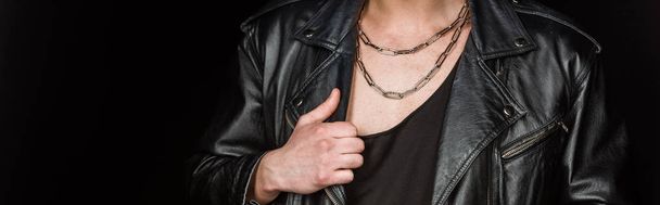 panoramic shot of man touching leather jacket isolated on black  - Foto, immagini
