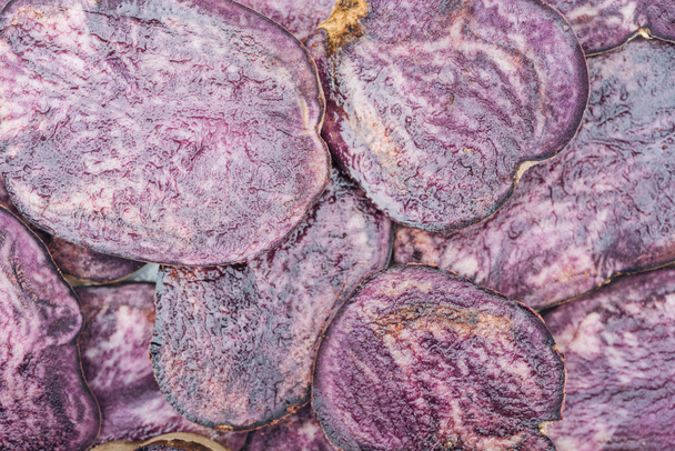 top view of cut fresh purple radish slices in stack - Fotoğraf, Görsel