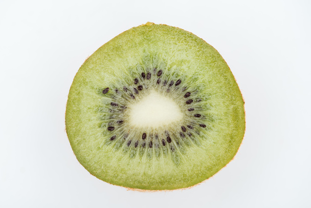 close up view of cut fresh nutritious green kiwi with seeds isolated on white - Zdjęcie, obraz