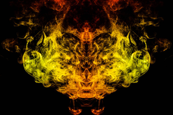 Smoke of different green, yellow, orange and red colors in the f - Photo, Image