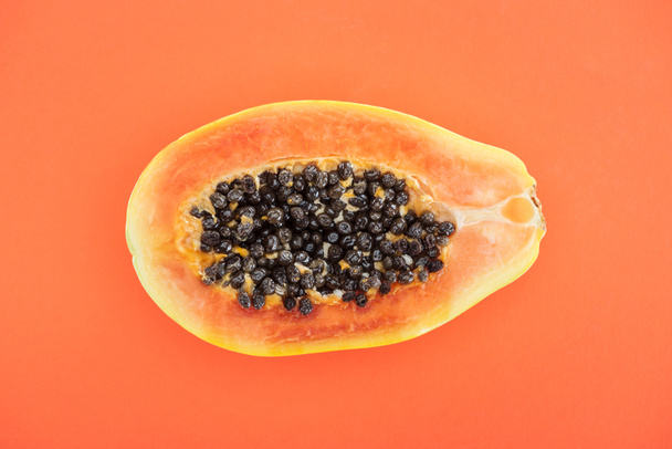 top view of ripe exotic papaya half isolated on orange - Photo, Image
