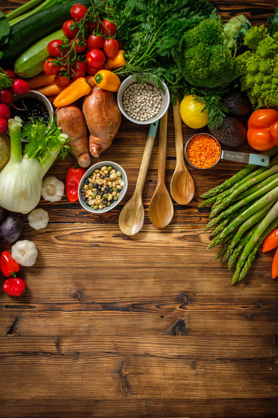 Assortment of fresh vegetables on wooden background - Foto, imagen