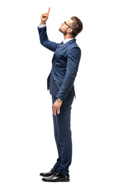 handsome businessman in suit pointing with finger up Isolated On White - Photo, Image