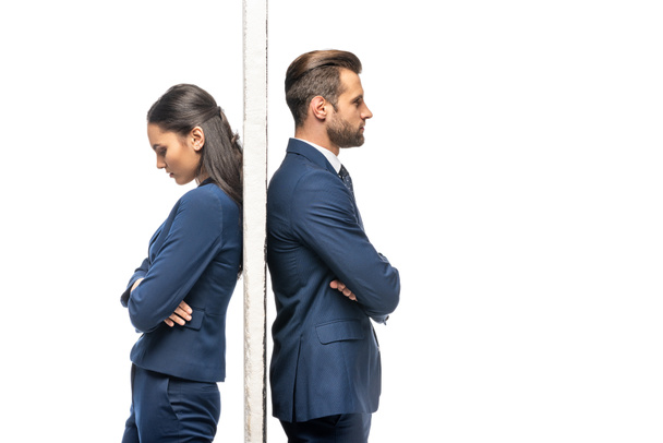 upset businessman and businesswoman separated by wall isolated on white - 写真・画像