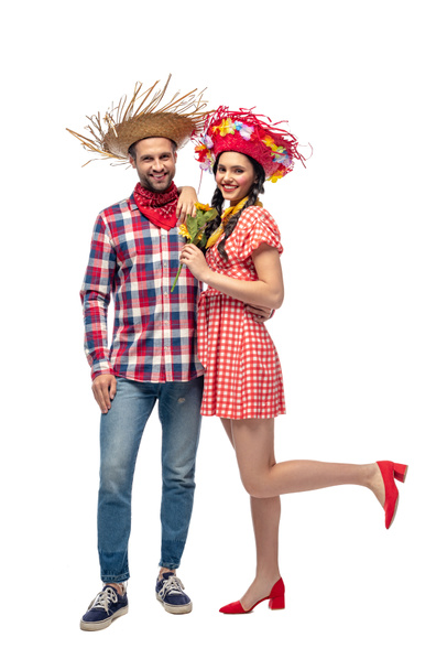 happy man and young woman in festive clothes with sunflowers isolated on white - Photo, image