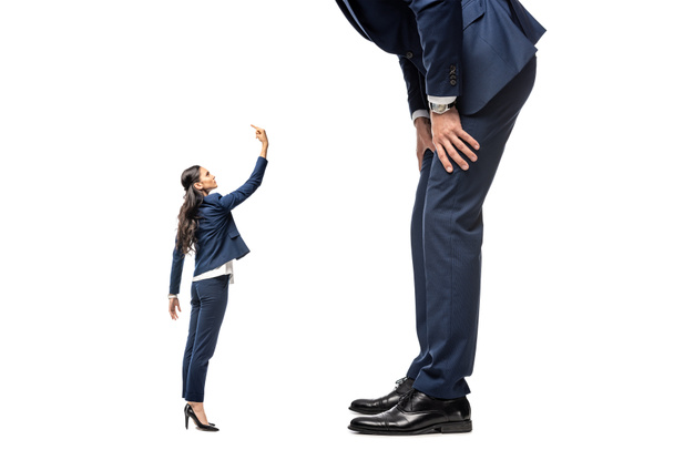 small businesswoman showing middle finger at big businessman Isolated On White - 写真・画像
