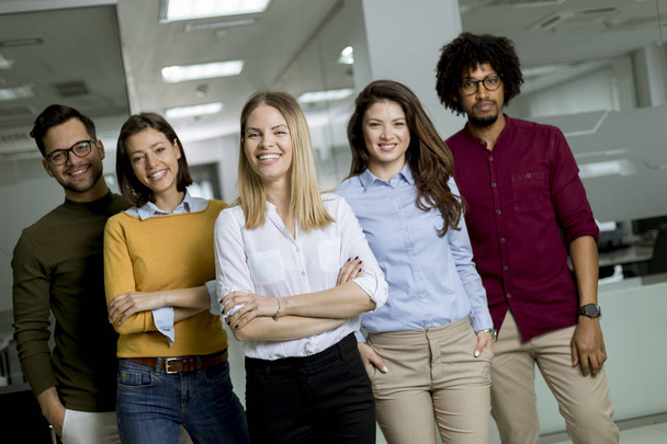 Portrait of group of young excited business people standing in office - Photo, Image