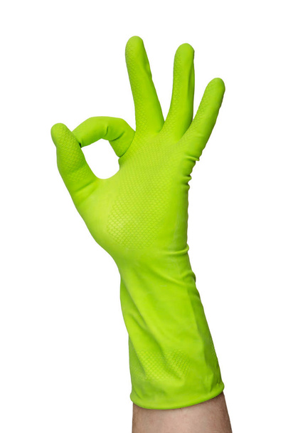 Hand in a green glove for cleaning - Foto, immagini