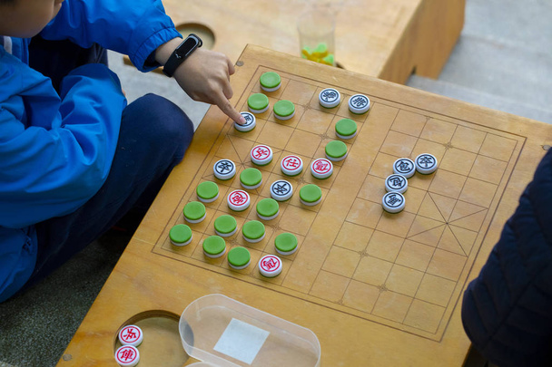 A közösségi tevékenység központ ad otthont a Limin szabadidő és sakk verseny (sakk szó: király, úriember, fázis, autó, ló... Kínai sakk) - Fotó, kép
