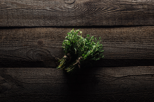 top view of green thyme on wooden brown rustic table - Photo, Image