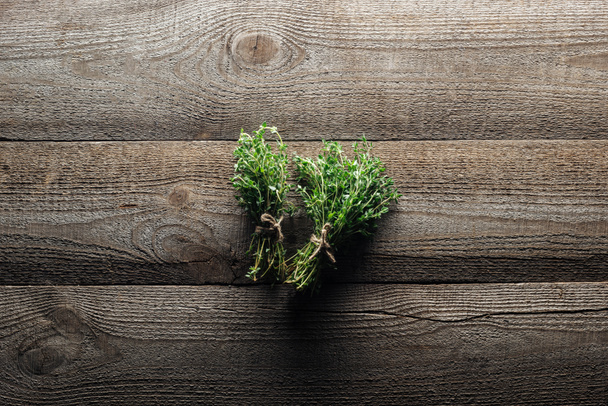 top view of green thyme on wooden weathered table - Фото, изображение
