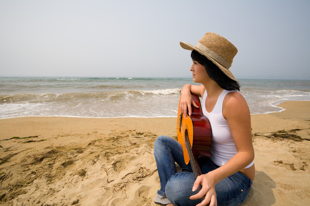 Young woman and guitar. Beach - Photo, Image
