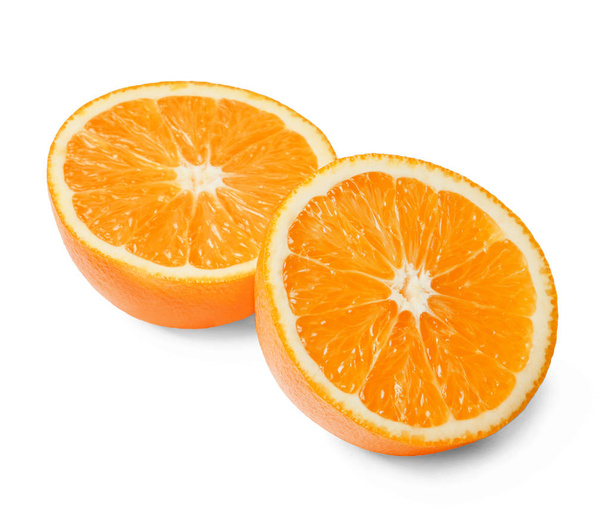 Two halves of fresh juicy orange on a white isolated background. Close-up. Top side view. - Foto, afbeelding