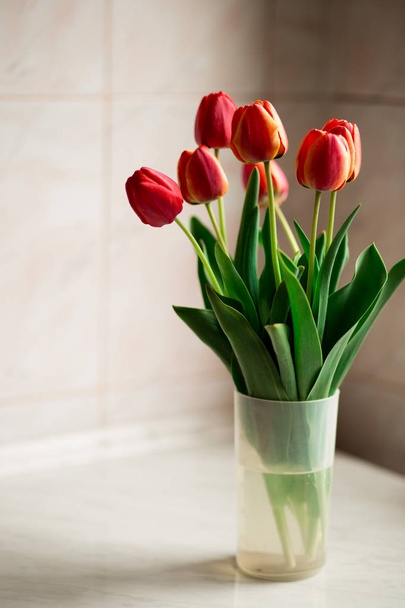 Still life with tulips bouquet on wooden table - Photo, Image