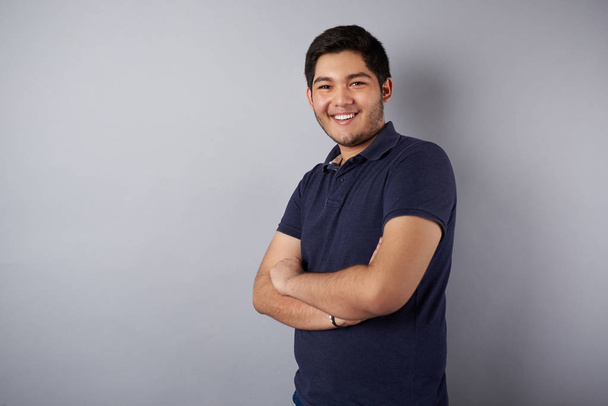 Young smiling man with crossed arms - Photo, Image