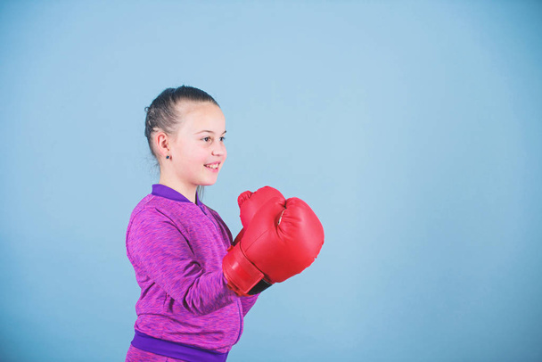 workout of small girl boxer. Sport success. sportswear fashion. Fitness diet. energy health. Happy child sportsman in boxing gloves. punching knockout. Childhood activity. Sporty beauty - Fotoğraf, Görsel