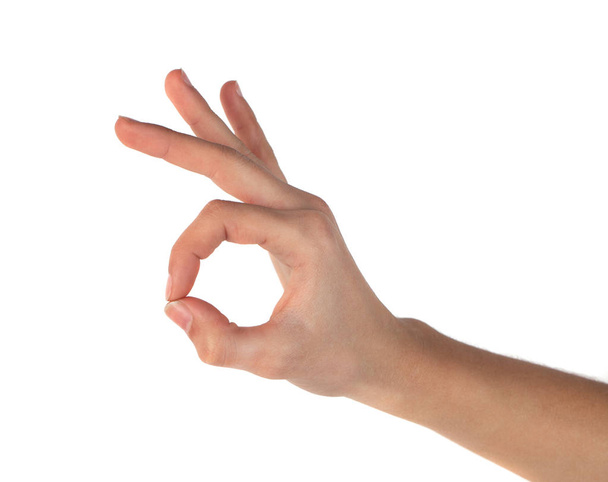 hands take gesture of okay sign on white backgrounds - Foto, Imagem