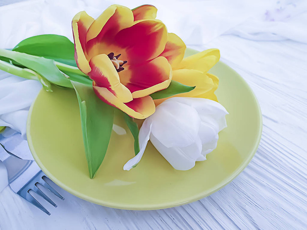 tulip flower plate on wooden background - Photo, Image