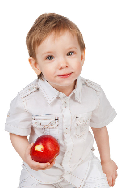 赤いりんごを持つ少年 - 写真・画像