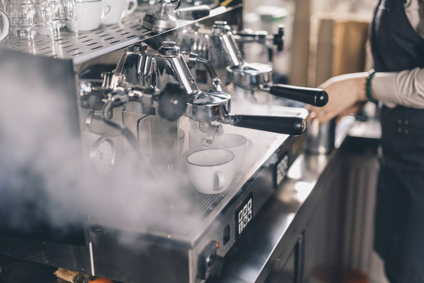 Steam near the group espresso machine in the cafe - Photo, Image