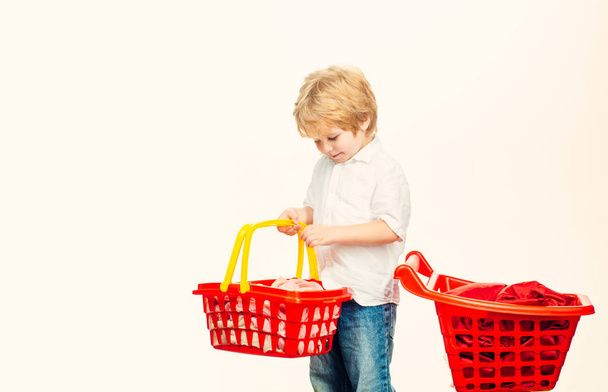 Kid hold plastic shopping basket toy. Buy with discount. Family shopping. Buy products. Play shop. Cute buyer customer client hold shopping cart. Kids store. Boy child shopping. Big purchase - Photo, image