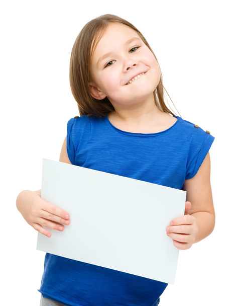 Little girl is holding blank banner - Foto, imagen