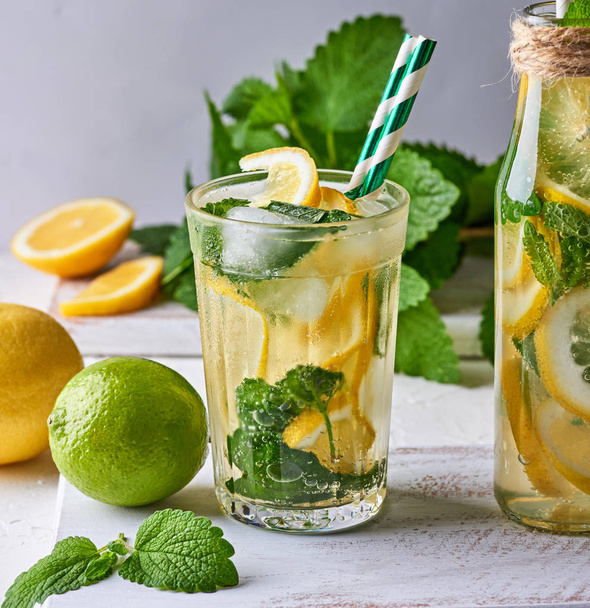 summer refreshing drink lemonade with lemons, mint leaves, lime  - Photo, Image