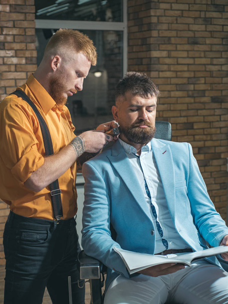 Styling with shaver. Barber scissors. Shaving man and razor man. Barber shop tools on old wooden background with copy space. Barber shop design. Hair Stylist and Barber. Bearded man or hipster. - Foto, Imagen