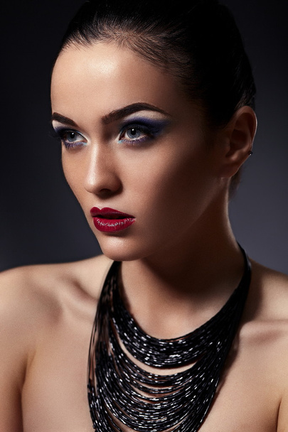 High fashion look.glamor closeup portrait of beautiful sexy stylish brunette Caucasian young woman model with bright makeup, with red lips, with perfect clean skin with accessories in studio - Fotografie, Obrázek