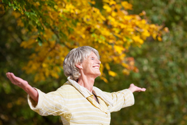 Senior Woman Enjoying Nature In Park - Fotó, kép