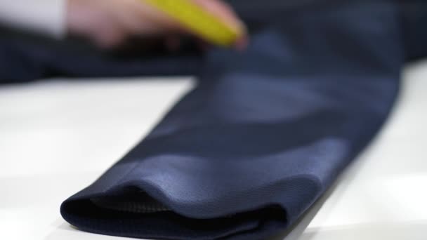 Measurement of jacket sleeve before dry-cleaning - Footage, Video