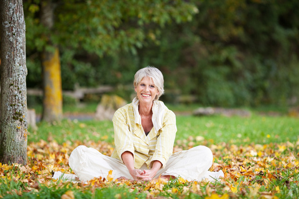 Senior Woman Relaxing In Park - Valokuva, kuva