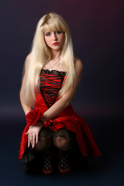 Beautiful girl with red flower - Fotografie, Obrázek