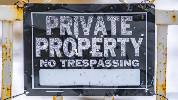 Panorama Close up view of a weathered sign that reads Private Property No Trespassing - Photo, Image