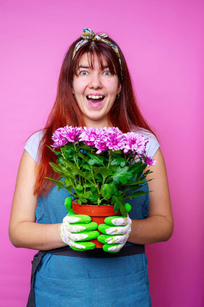 Photo of cheerful woman with chrysanthemums - Photo, Image