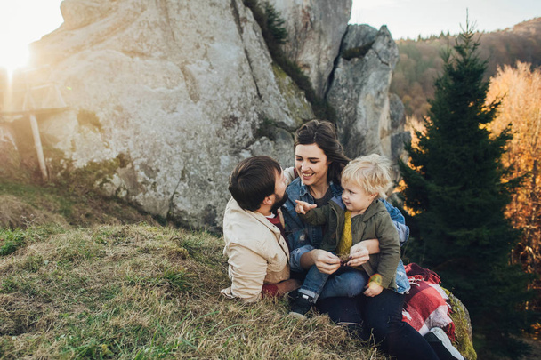 Happy family: mother father and child in mountains.  - Foto, imagen