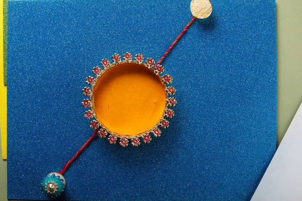 rakshabandhan with these handcrafted homemade rakhi's Indian festival celebration Top view in white background. Many rakhis, multiple colorful multicolored - Fotó, kép