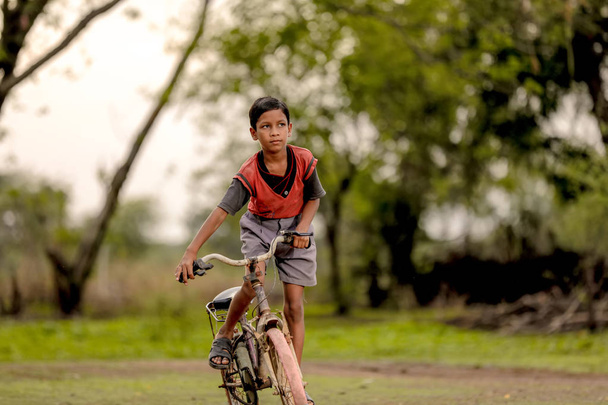 indian child on bicycle - Photo, Image