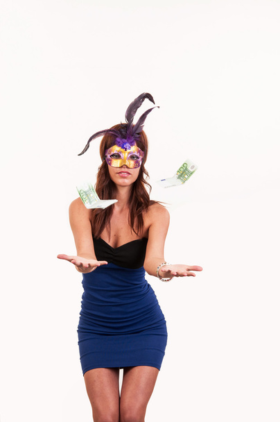 Young woman in purple mysterious venetian mask throw money. Masq - Foto, Imagen