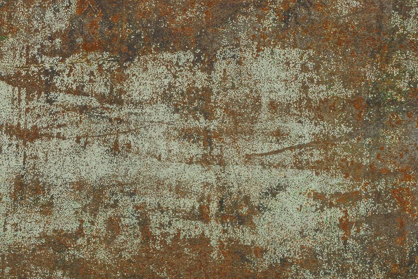 Grijsbruine achtergrond uit een fragment van een muur van ijzer - Foto, afbeelding