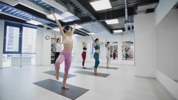 Dolly move of women exercising healthy lifestyle yoga training - Footage, Video