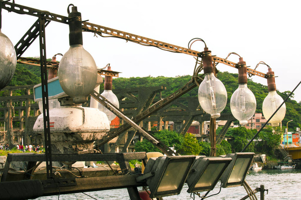 Fish port in northern Taiwan, fishing port in Keelung Peace Island, lamps on fishing boats - Photo, Image