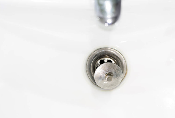 water drain in white ceramic sink - Photo, Image