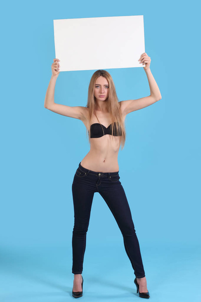 Young sexy girl with white signs for text - 写真・画像